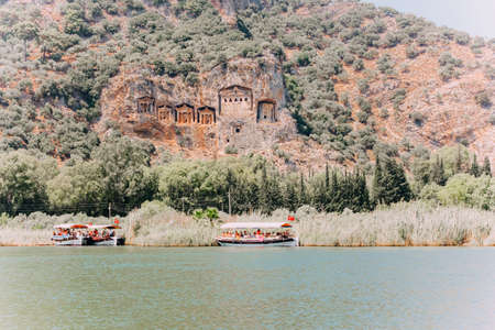 Azmak River, Akyaka, Mugla, Turkey. Nature composition. Summer Background. Countryside landscape with lake. Boat sails on the Azmak River. People are taking tour on Azmak River in Akyaka Village.のeditorial素材