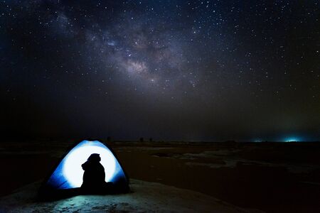 A woman silhouette in a tentの写真素材