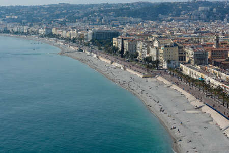 NICE, FRANCE - MARCH 13: People enjoy the walks and jogging on the Promenade des Anglais year round. Built in 1820s it is one of the citys main attractions and allows residents and visitors to stroll along the coast for several miles, Nice, France on Maのeditorial素材