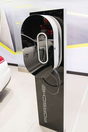 Detroit, MI, USA - January 12, 2015: Porsche plug-in hybrid charging station on display during the 2015 Detroit International Auto Show at the COBO Center in downtown Detroit.のeditorial素材