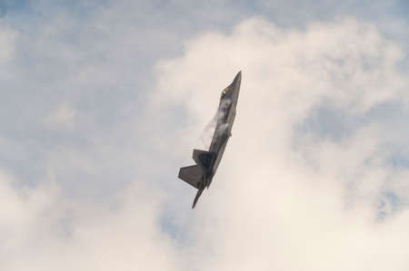 CAMP SPRINGS, MD, USA - SEPTEMBER 19, 2015: The F-22 performs during the 2015 Joint Base Andrews Air Show held at Joint Base Andrews in Camp Springs Maryland.のeditorial素材