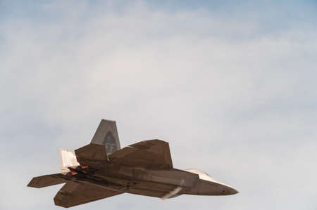 CAMP SPRINGS, MD, USA - SEPTEMBER 19, 2015: The F-22 performs during the 2015 Joint Base Andrews Air Show held at Joint Base Andrews in Camp Springs Maryland.のeditorial素材