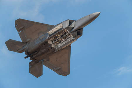 CAMP SPRINGS, MD, USA - SEPTEMBER 19, 2015: The F-22 performs during the 2015 Joint Base Andrews Air Show held at Joint Base Andrews in Camp Springs Maryland.のeditorial素材