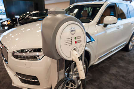 Miami Beach, FL, USA - November 6, 2015: Volvo XC-90 hybrid charging station on display during the 2015 Miami International Auto Show at the Miami Beach Convention Center in downtown Miami Beach.のeditorial素材