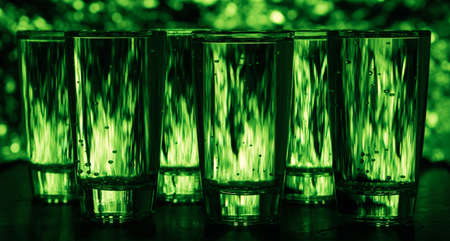 Glasses of cool water on a green backgroundの写真素材