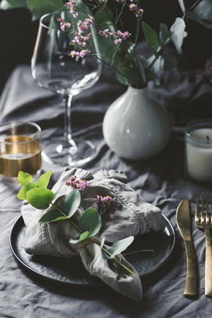 Festive table setting with floral decor. The concept of Thanksgiving or wedding dinner.