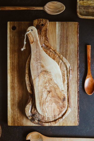 Top view of rustic wooden kitchenware. cutting boards and spoons. Eco and natural cooking concept.の写真素材