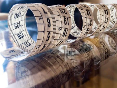 Tape measure, used by dressmakers and tailors to take measurements of the clothes to be made.の写真素材
