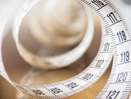Tape measure, used by dressmakers and tailors to take measurements of the clothes to be made.の写真素材