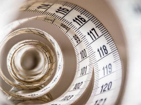 Tape measure, used by dressmakers and tailors to take measurements of the clothes to be made.の写真素材