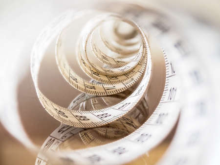 Tape measure, used by dressmakers and tailors to take measurements of the clothes to be made.