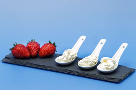 Whipped cream, with strawberries. Product derived from cow's milk.の写真素材