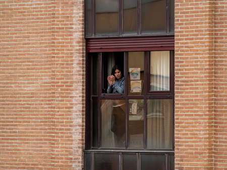 Madrid, Spain - 29 March 2020: State of alarm in Spain on Covid-19 applause from the balconies.のeditorial素材