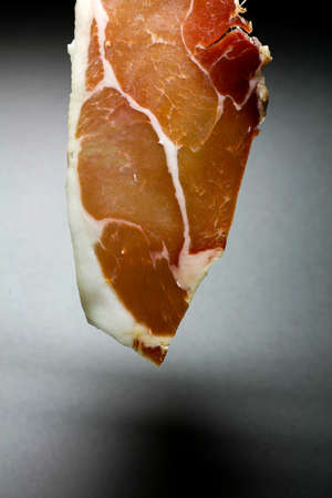 Slices of Serrano ham. Typical product of the pig, is obtained from the pork put in salted and cured...