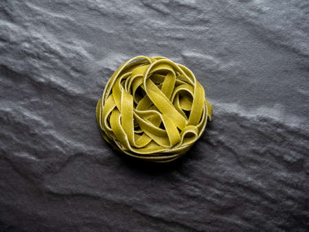 Hard pasta made from wheat flour, typical food from Italy, with great calorific value and high content of fast absorbing carbohydrates.の写真素材