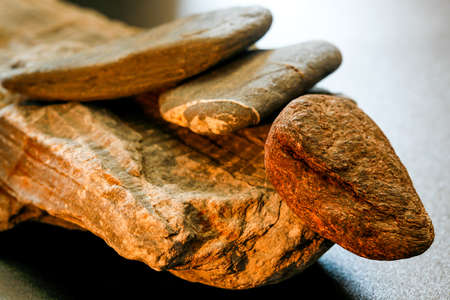 Balancing stones on a black background. Several piedrs rest in balance.