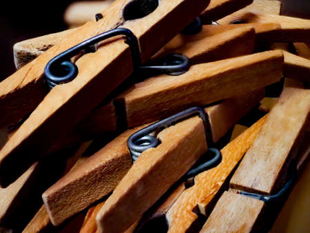 Clothespins, reflected on a shiny glass backgroundの写真素材