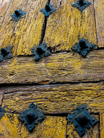 Details of an old wooden door in the city of Avila. Spain.の写真素材