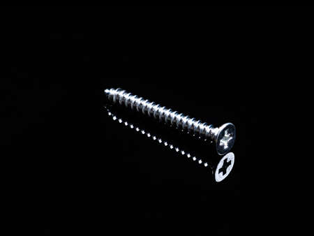 Screws and nuts of different types of threadsの写真素材