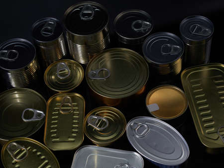 Different types of cans with prepared foods for consumption, vegetables, fish and meatの写真素材
