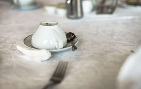 Teacup turned over ready for serving teaの写真素材