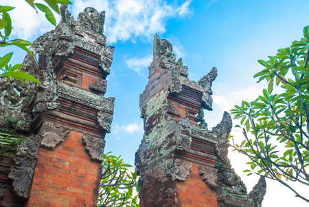 Split brickwork marking doorway to a Balinese temple complex