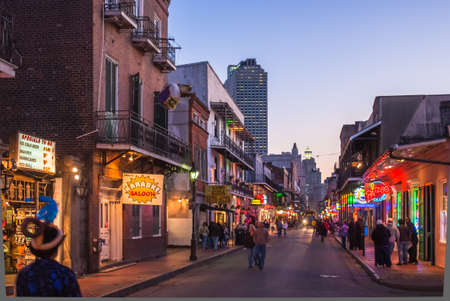 NEW ORLEANS, USA - CIRCA MARCH 2008: Crowds of people and neon lights at dusk circa March 2008 in New Orleans, USA. Tourism is the area's major source of income after Hurricane Katrina in 2005.のeditorial素材