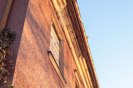 Abandoned house sealed with bricks in winterの写真素材