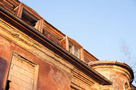 Abandoned house sealed with bricks in winterの写真素材