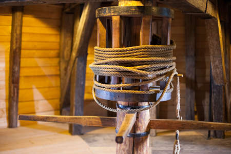Medieval winch for hoisting loads up a towerの写真素材