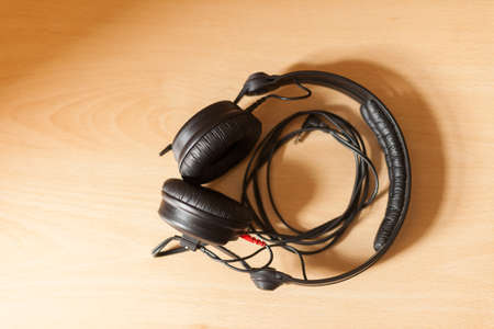DJ headphones on a wooden surfaceの写真素材