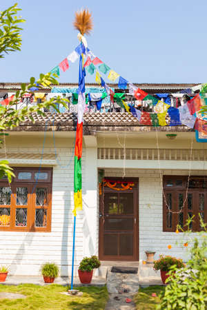 Buddhist house with prayer flags in rural Nepalの写真素材