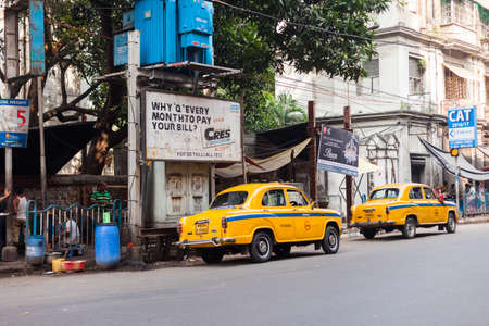 KOLKATA, INDIA - 22 Oct 2016: A brightly painted local bus speeds through the city on October 22, 2016 in Kolkata (Calcutta), Indiaのeditorial素材