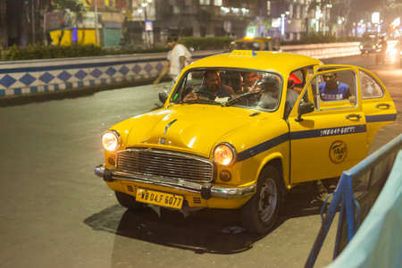 KOLKATA, INDIA - 21 Oct 2016: A traditional Ambassador taxi at night October 21, 2016 in Kolkata...