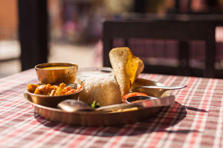 Vegetarian Nepali Thali (Dal Bhat) set, the traditional dinner dish of Nepalの写真素材