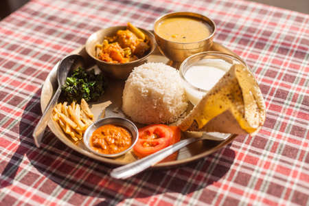 Vegetarian Nepali Thali (Dal Bhat) set, the traditional dinner dish of Nepalの写真素材