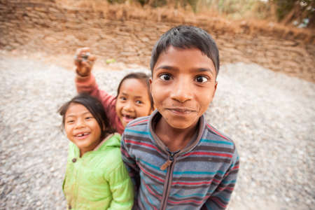 BANDIPUR, NEPAL - 21 December 2016: Nepali children play around for the camera, 21 December 2016 in Bandipur, Nepalのeditorial素材