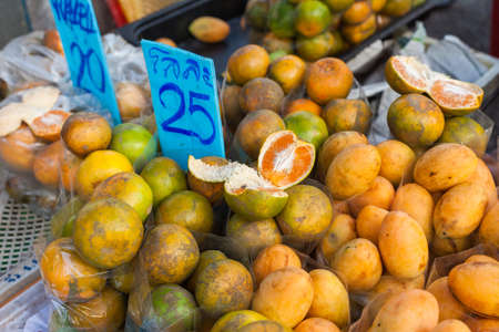 Fresh oranges and apricots for sale, Chiang Mai Gate Night Food Marketの写真素材