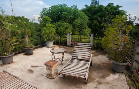 Lounge chair. Rustic Indonesian outdoor wood furnitureの写真素材