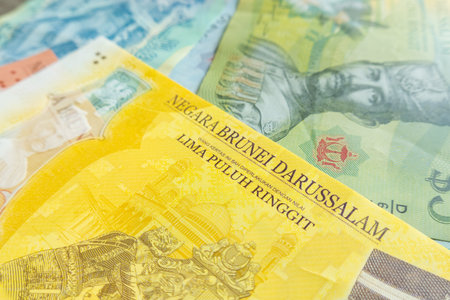 Examples of Brunei dollar notes, equivalent to Singapore dollars