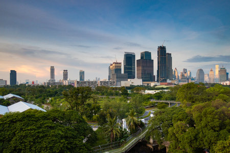 Skyscrapers and skyline of Bangkok above a parkの写真素材