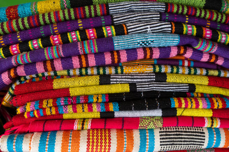 Brightly colored woven cloth at Tais market, Diliの写真素材