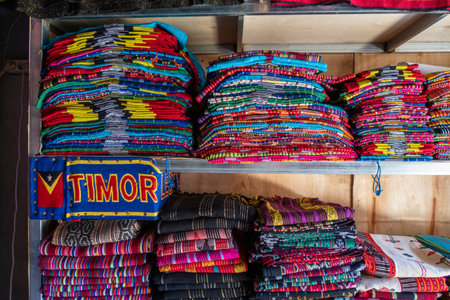 Brightly colored woven cloth at Tais market, Diliの写真素材
