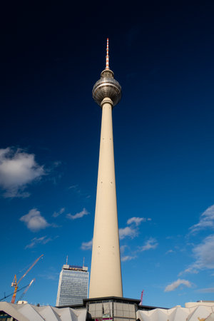 Berlin's iconic TV Tower against a blue sky from belowの写真素材
