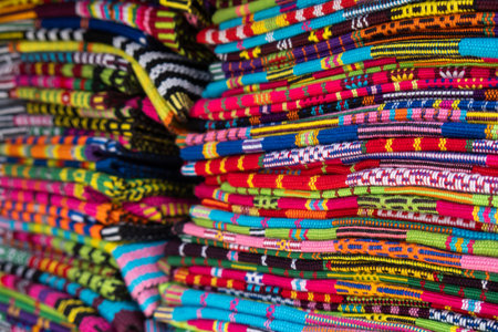 Brightly colored woven cloth at Tais market, Diliの写真素材
