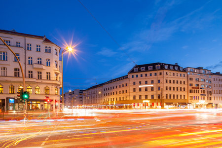 Traffic passes through Berlin's Rosenthaler Platz in the eveningの写真素材