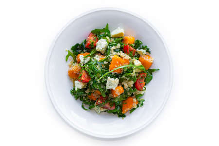 Tabbouleh salad plate with bulgur, blue cheese and pumkin on isolated white backgroundの写真素材