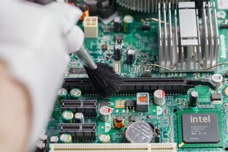 Circuit board close-up video chip motherboard large wired chip many legs on the board green boardの写真素材