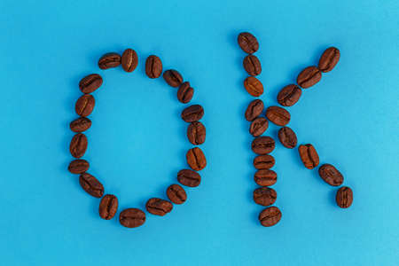 coffee beans inscription ok on a blue backgroundの写真素材
