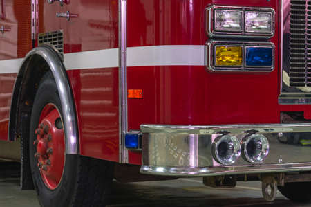 A special sound signal of a fire truck. The siren of a fire truck. View of the fire truck from the front. Shiny chrome fire truck parts. fire truck headlights.の写真素材